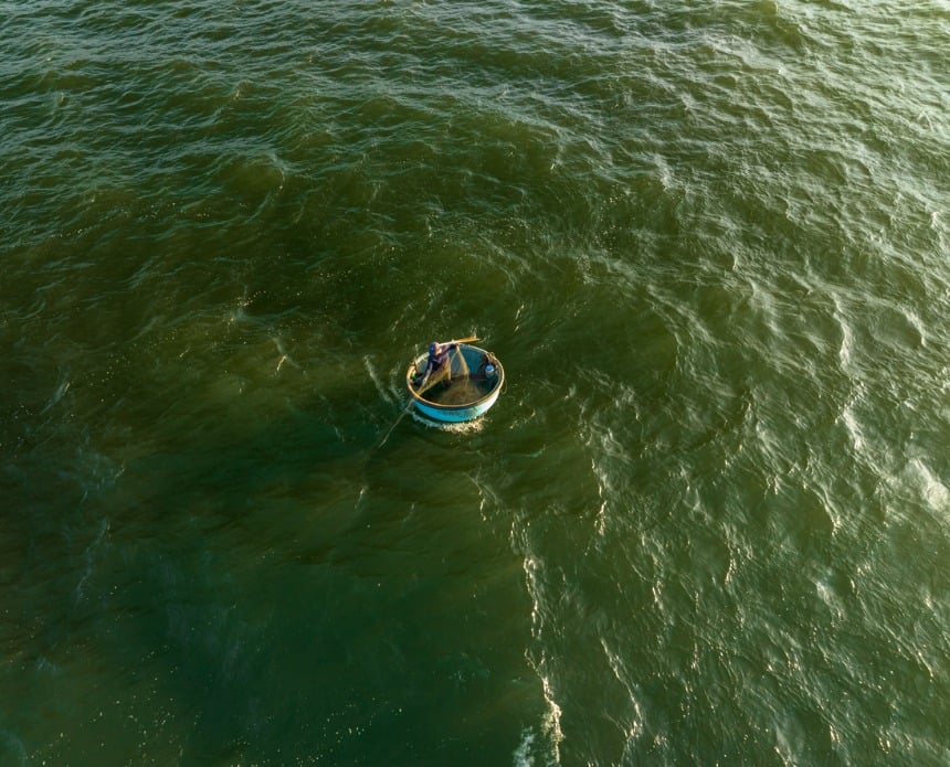 This image depicts a person stranded in a vast ocean, symbolizing marketing and sales teams drowning in impure, fragmented data that hinders effective data enrichment.