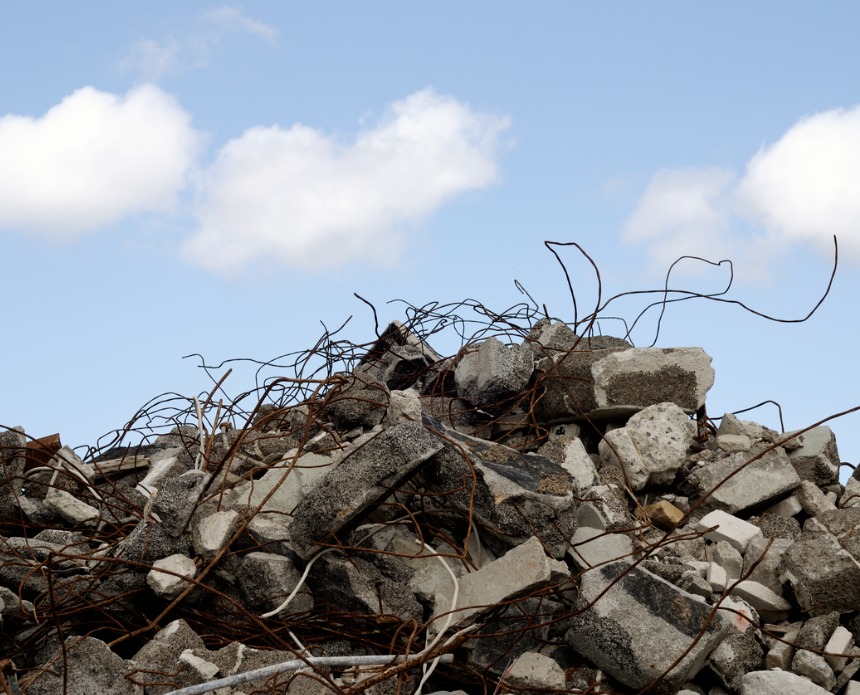 Image of tangled metal and rubble symbolizing a crumbling foundation caused by poor RevOps data quality